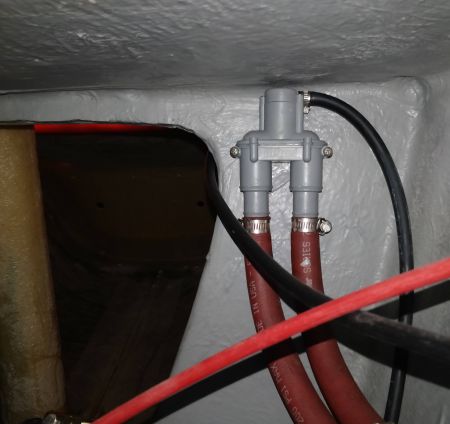 Mounted Vetus TV Anti-Siphon Valve. Step 1 - Remove two mounting screws. The hoses do NOT need to be removed.