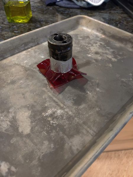 4. After being heated up, oil is spread over the acrylic to help the hole saw press the material over the socket
