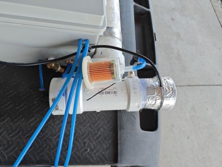 Silica beads can give off small particles during heating, a generic fuel filter was added to capture them before they could be blown into the engine oil filler tube