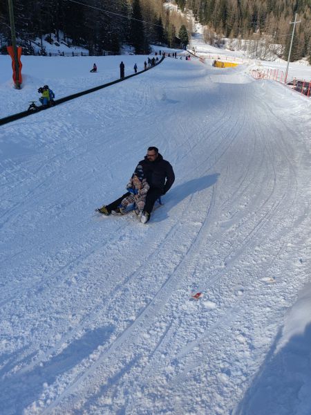 A fun little sledding hill with a magic carpet