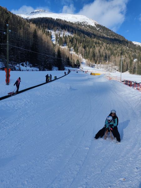 Lots of kids and families bombing down the hill