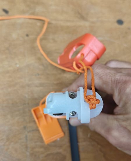 Remove the two Phillips head screws and slide the white plastic up and off of the unit