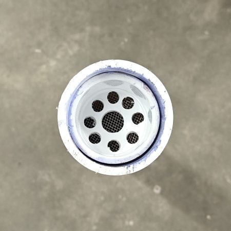 In the exhaust end of the desiccant drying tube has a 1-1/2" end cap with holes drilled and a stainless mesh to prevent silica beads from entering the baffle tee