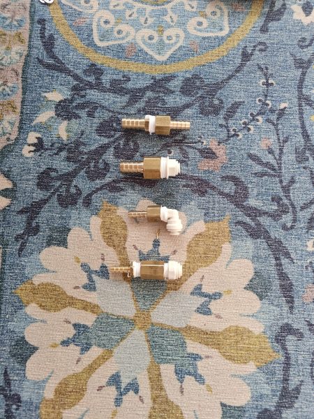 Lots of adapters were needed to match the new water maker with the existing thru-hulls and hoses