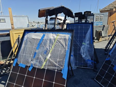 Mutliple coats being applied to the frames of the solar panels