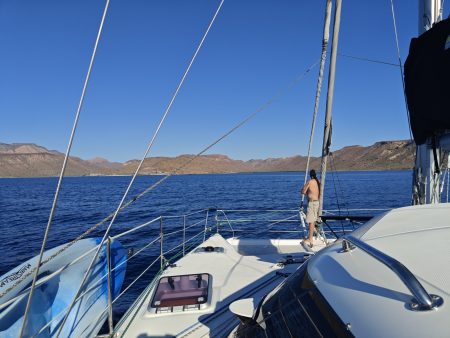 Jack keeping an eye out and we motor into the anchorage