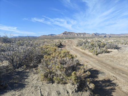 Hiking the road, the "Pink House" is barely visible in the distance
